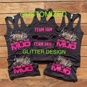 May include: Five black tank tops with a pink glitter design that says "I Sparkle Even In The Mud" and "Team Fam".