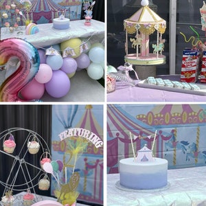 May include: A circus-themed birthday party with a two-tier cake decorated with a pink and white tent, a carousel cake topper, and a Ferris wheel cupcake stand. The party decorations include a pink and white striped tent, a rainbow balloon arch, and a sign that says "Featuring 2".