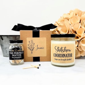May include: A gift set featuring a candle, matches, and a decorative box. The candle reads "Shitshow COORDINATOR (hope you brought alcohol)". The match jar says "THE PERFECT MATCH". The box is labeled "Jamie".