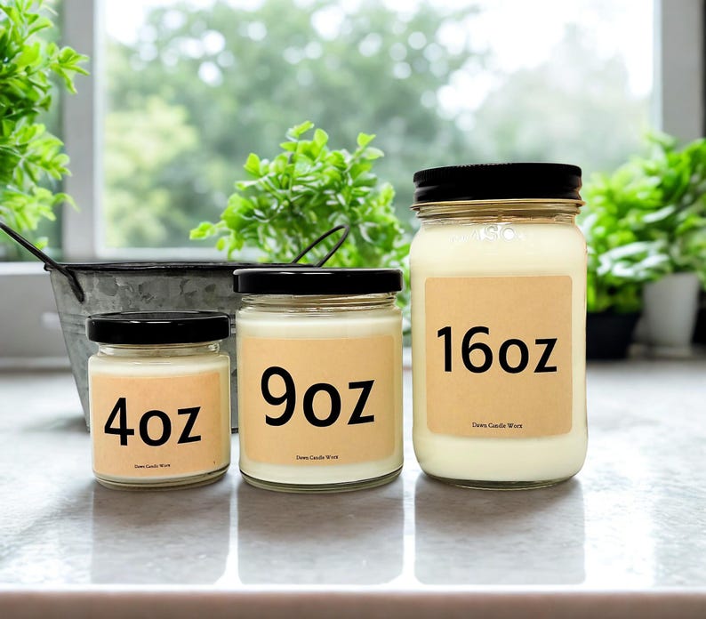 May include: Three glass jars of scented candles with black lids. The jars are labeled with sizes: 4oz, 9oz, and 16oz. The candles have a creamy white wax and are displayed on a light-colored surface.