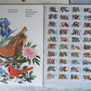 May include: A 1982 United States Postal Service mint set featuring fifty state birds and flowers. The cover art includes illustrations of a roadrunner, cardinal, and other birds with flowers. The set includes a sheet of stamps with various bird and flower illustrations.