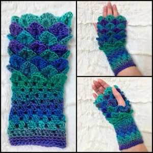 May include: A pair of teal, green, and purple crocheted fingerless gloves with a scale pattern.