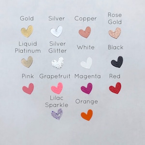 May include: A chart of heart-shaped stickers in various colors and finishes, including gold, silver, copper, rose gold, liquid platinum, silver glitter, white, black, pink, grapefruit, magenta, red, lilac sparkle, and orange.