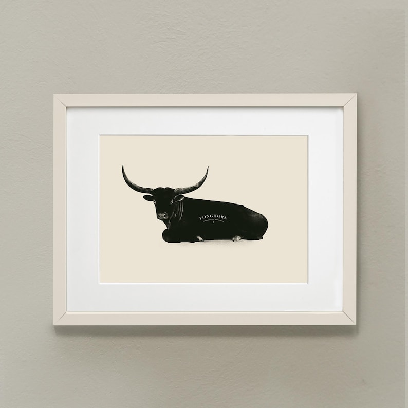 May include: A black and white illustration of a longhorn steer lying down. The steer is facing the left side of the image. The text "Longhorn" is printed on the steer's side.