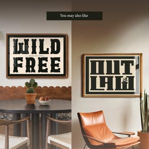 May include: Two framed prints with black text on a cream background. The print on the left says "WILD AND FREE" and the print on the right says "OUTLAW".