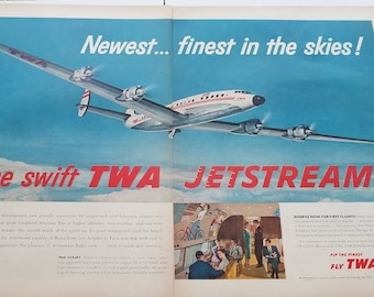May include: A vintage TWA advertisement featuring a red, white, and blue Lockheed Constellation airplane flying through a blue sky with clouds. The text reads "Newest... finest in the skies! The swift TWA JETSTREAM."  The ad also features a smaller image of people boarding the plane and a description of the plane's features.