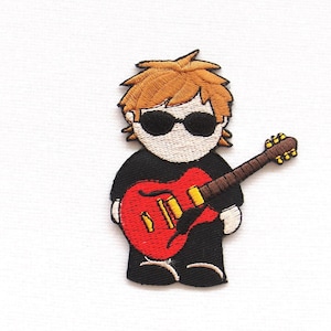 May include: Embroidered iron-on patch of a cartoon character with brown hair, wearing sunglasses and a black shirt, holding a red electric guitar.