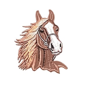 May include: Embroidered patch of a brown horse's head with a white star on its forehead. The horse is wearing a brown bridle with a white noseband.