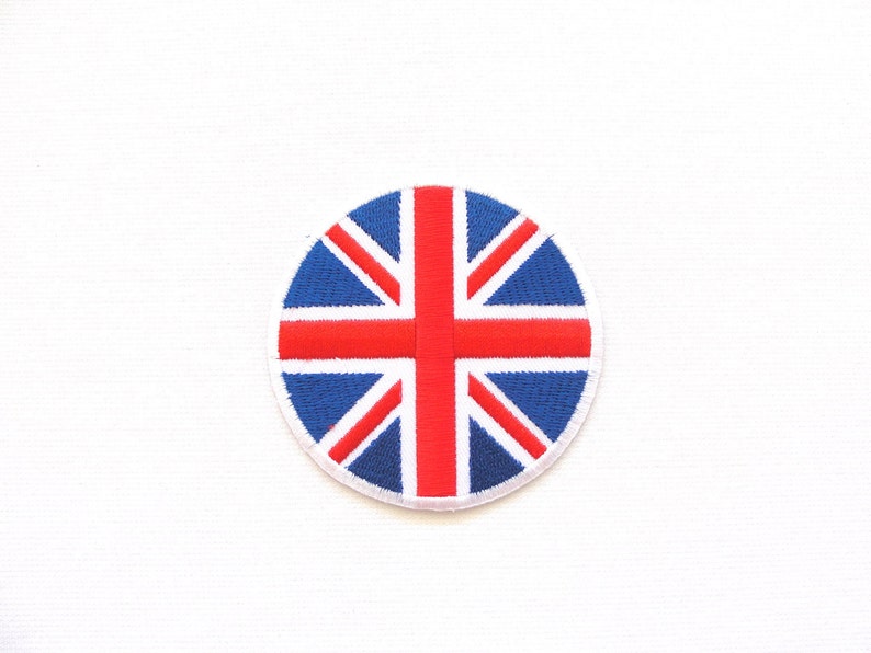 May include: A round embroidered patch with the Union Jack flag design. The flag is red, white, and blue.