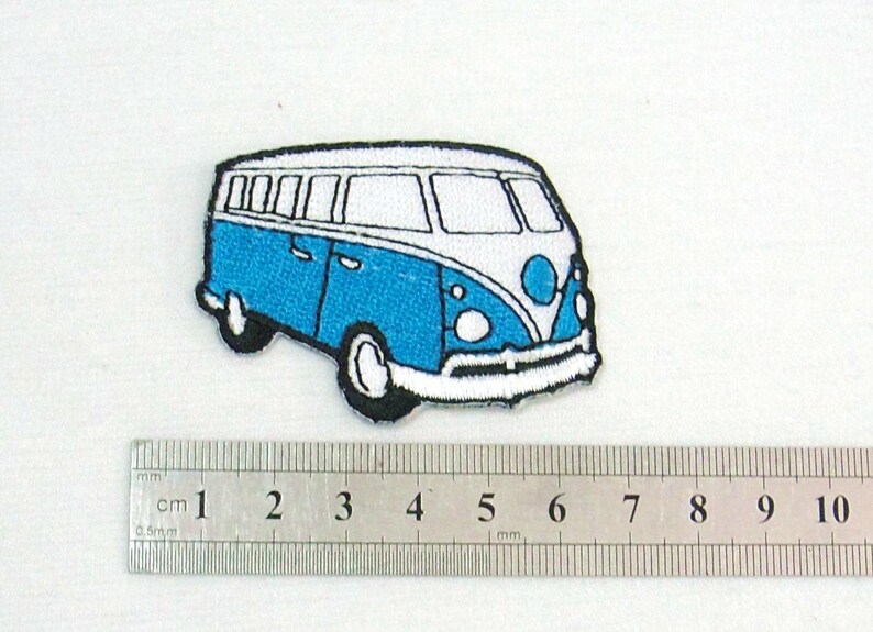 May include: Embroidered patch featuring a blue and white vintage van design. The patch has a black outline and measures approximately 3 inches in length. Ideal for adding to clothing or accessories.