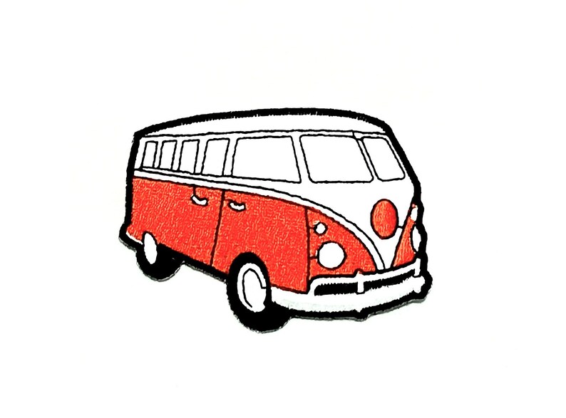 May include: Embroidered patch featuring a red and white vintage van with black accents. The van has a classic design with a rounded front, windows, and wheels. The patch is likely for clothing or accessories.
