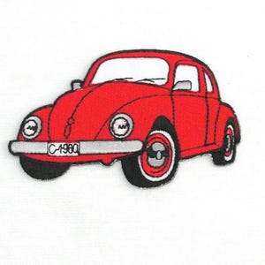 May include: Embroidered patch of a red vintage car with black tires and white rims. The car has a white windshield and windows. The license plate reads "C-1960".