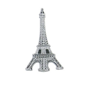May include: A black and white Eiffel Tower patch. The patch features a detailed depiction of the iconic Parisian landmark, with intricate lattice work and architectural details. The patch is likely for decorative purposes, such as on clothing or accessories.