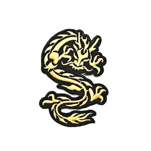 May include: A gold embroidered dragon patch with black outlining. The dragon is curled up in a defensive position with its claws out.