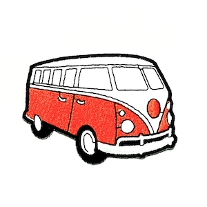 May include: Embroidered patch featuring a red and white vintage van with black accents. The van has a classic design with a rounded front, windows, and wheels. The patch is likely for clothing or accessories.