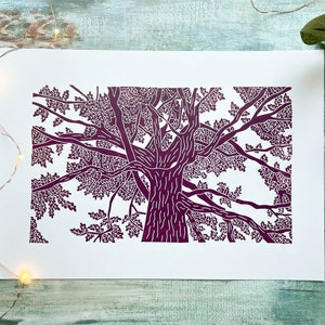 A plum coloured lino print of an oak tree. The perspective is from standing underneath the tree looking up to the top of it.