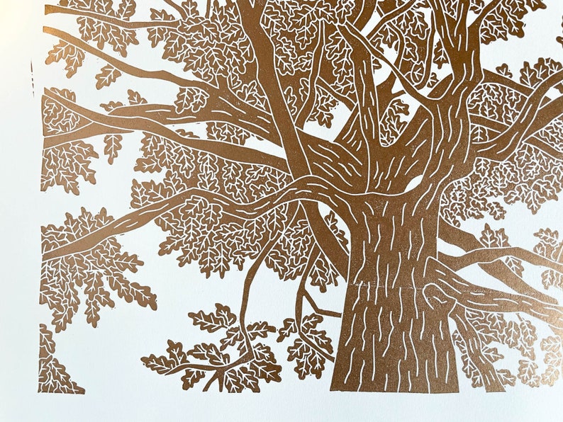 A copper lino print of an oak tree. The perspective is from standing underneath the tree looking up to the top of it.