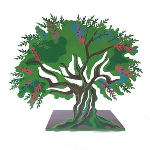 May include: A green metal tree sculpture with brown branches and pink and blue flowers. The tree is standing on a brown base.