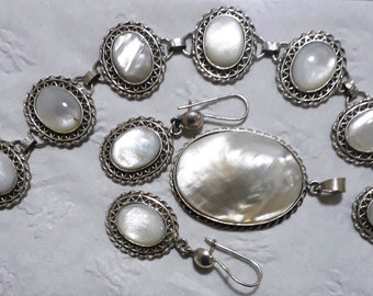 Sterling Silver Mother of pearl set of Braclet, Pendant, and Earrings.