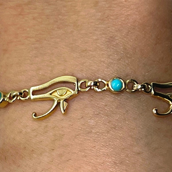 Hallmark 18 Karat Gold Cuff Bracelet, Eye of Horus decorated with Turquoise gemstone.