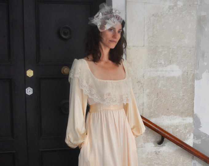 1980's vintage wedding dress with a deep neckline and pockets