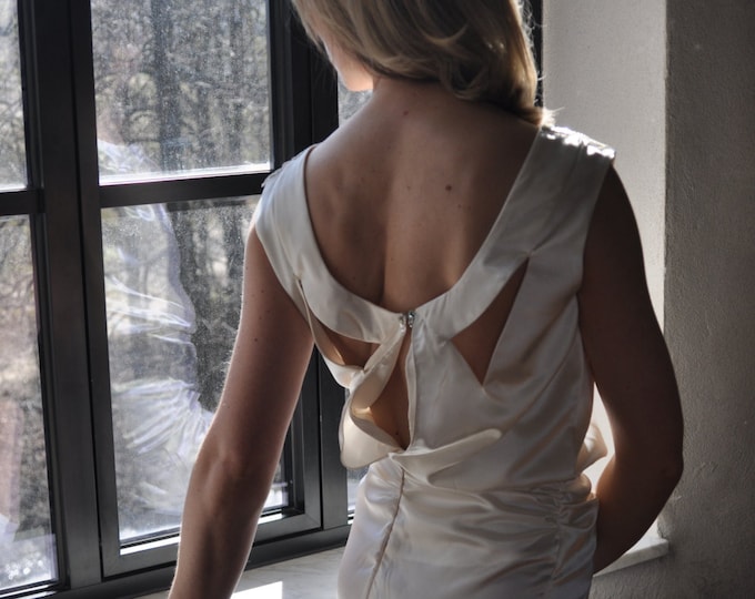 1930s inspired wedding dress with feathers, crystals, and silver sequins