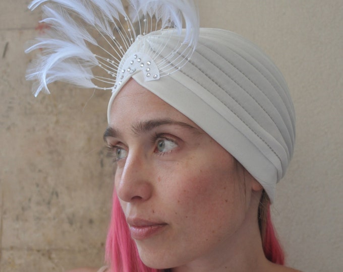 Vintage style bridal turban with feathers and gemstones.