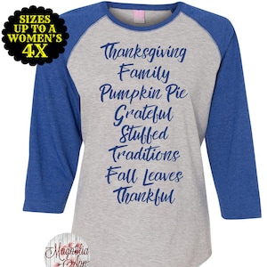 May include: A grey and blue baseball tee shirt with the text "Thanksgiving Family Pumpkin Pie Grateful Stuffed Traditions Fall Leaves Thankful" printed in blue on the front.