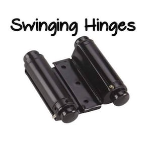 May include: Black swinging hinges for a door. The hinges are made of metal and have a polished finish.