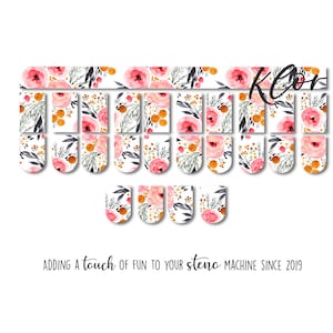 May include: Floral nail art stickers with a watercolor design featuring pink roses, green leaves, and orange accents. The word "Klor" is written in black script. The text "Adding a touch of fun to your steno machine since 2019" is also included.