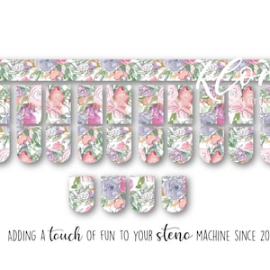 May include: Floral nail wraps in a watercolor style, featuring pink, purple, and green flowers on a white background. The design includes a strip for the top of the nail and individual wraps. Text at the bottom reads "Adding a touch of fun to your steno machine since 2019."