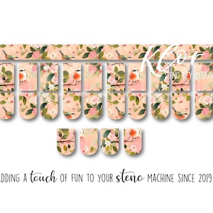 May include: Floral steno machine key stickers with a bird and flower design. The stickers have a peach background with pink flowers and green leaves. The text "Adding a touch of fun to your steno machine since 2019" is at the bottom.