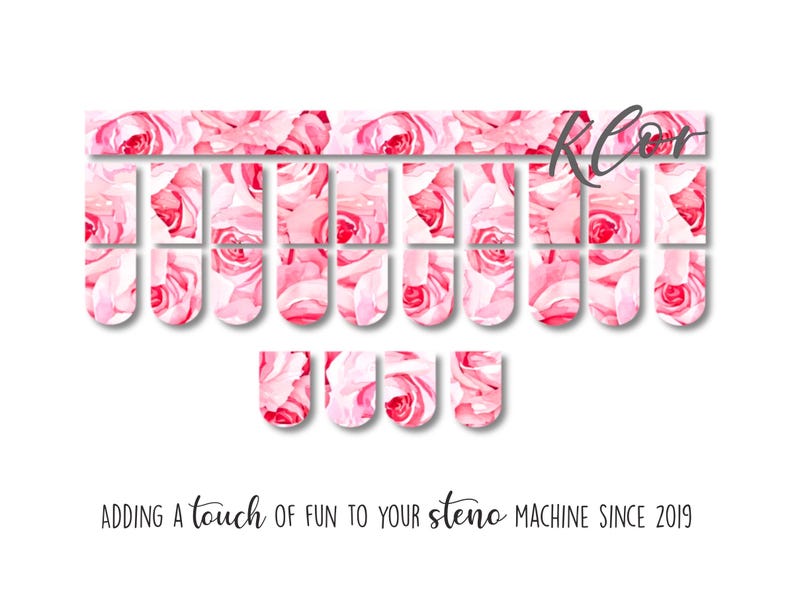 May include: A set of steno machine key covers with a watercolor rose design in shades of pink and red. The covers are arranged on a white background. Text at the bottom reads, "Adding a touch of fun to your steno machine since 2019."
