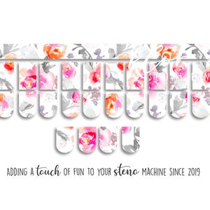 May include: Floral-themed steno machine key covers with a watercolor design. The keys feature pink, orange, and gray floral patterns on a white background. The text "Adding a touch of fun to your steno machine since 2019" is also visible.