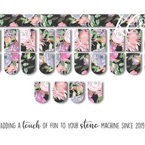May include: Floral-themed steno machine keycaps in various sizes. The keycaps feature watercolor-style flowers in pink, purple, and green on a black background. The text "Adding a touch of fun to your steno machine since 2019" is also visible.