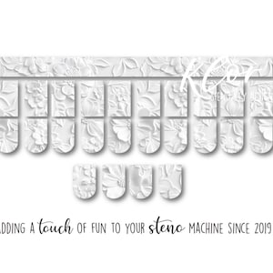 May include: White floral-patterned steno machine keys. The keys are arranged in rows and columns, with a decorative floral design. The text "ADDING a touch of fun to your steno MACHINE SINCE 2019" is at the bottom.