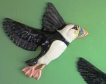 Ceramic wall hanging flying birds. An Improbability of Puffins plaque.