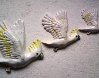 Wall hanging flying birds. Crackle of Cockatoos plaque.