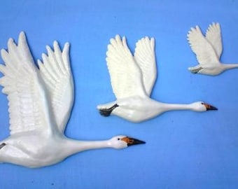 Ceramic wall hanging flying birds. A Formation of Swans plaque.