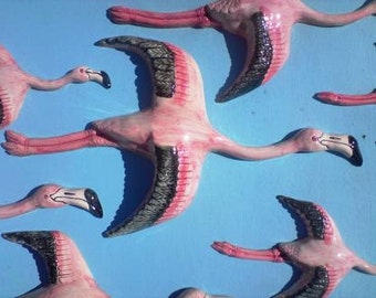 Wall hanging flying birds. A Flamboyance of Flamingos plaque.