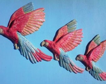 Ceramic wall hanging flying birds. A Cry of Scarlet Macaws plaque.
