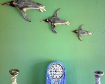 Wall hanging flying birds. A Parcel of Penguins