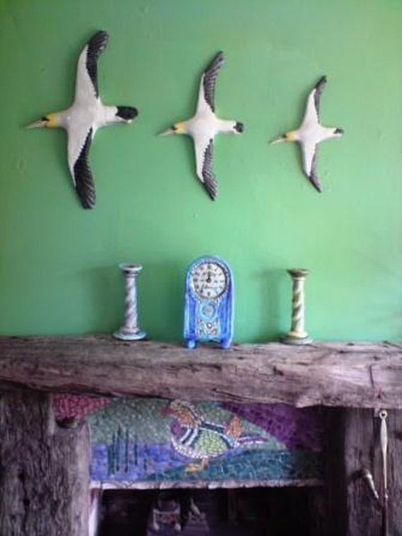 Ceramic wall hanging flying birds. A Company of Gannets plaque.