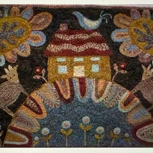 May include: A colorful, folk art style rug featuring a house with a red roof, flanked by stylized flowers and birds. The rug has a dark background with a repeating floral pattern at the bottom. The overall design is whimsical and decorative.
