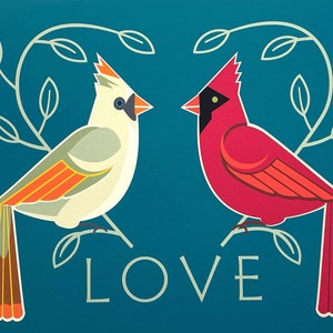 May include: A teal blue background with two stylized birds facing each other. The bird on the left is white with orange accents and the bird on the right is red with orange accents. The birds are perched on branches with green leaves. The word "LOVE" is written in white below the birds.