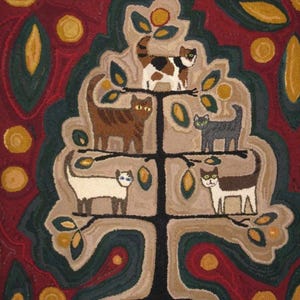May include: A colorful, handmade rug featuring a stylized tree with six cats perched on its branches. The cats are various colors, including brown, black, and white. The background is a deep red with green and yellow accents.