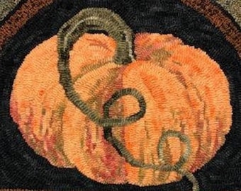 May include: A hand-hooked rug featuring a large orange pumpkin with a green stem. The pumpkin is centered on a black background with a brown border. The rug has a textured, handmade appearance, perfect for fall decor.