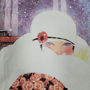 May include: A woman wearing a white fur coat and a white hat with a red flower on it. She is standing in a snowy forest with a car in the background.