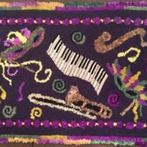 May include: A rectangular rug with a dark purple background features a Mardi Gras theme. The design includes a piano keyboard, trombone, saxophone, and masks in yellow, green, and purple. The border is purple with green and yellow accents.