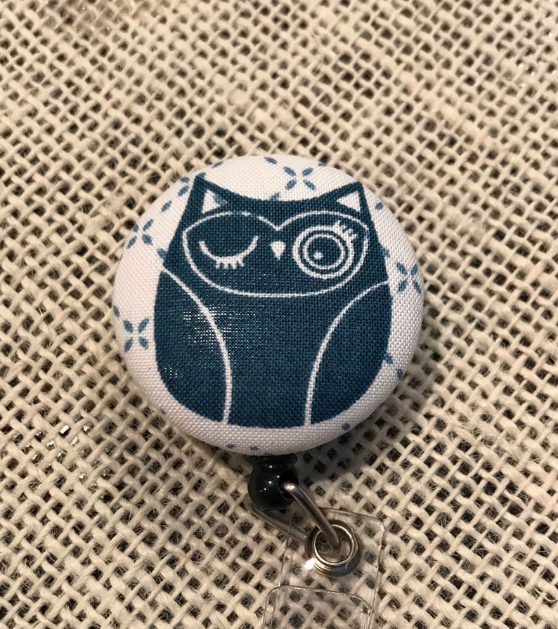 Winking owl button badge reel Comes in red or blue!